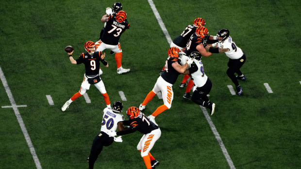 Cincinnati Bengals quarterback Joe Burrow (9) throws a pass in the first quarter of an NFL wild-card playoff football game between the Baltimore Ravens and the Cincinnati Bengals, Sunday, Jan. 15, 2023, at Paycor Stadium in Cincinnati. Baltimore Ravens At Cincinnati Bengals Afc Wild Card Jan 15 595